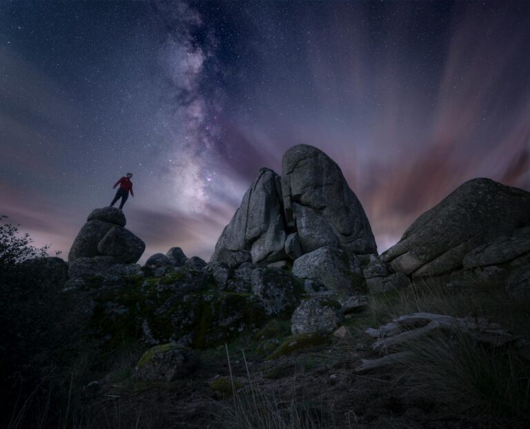 nighttime milky way over rocky landscape