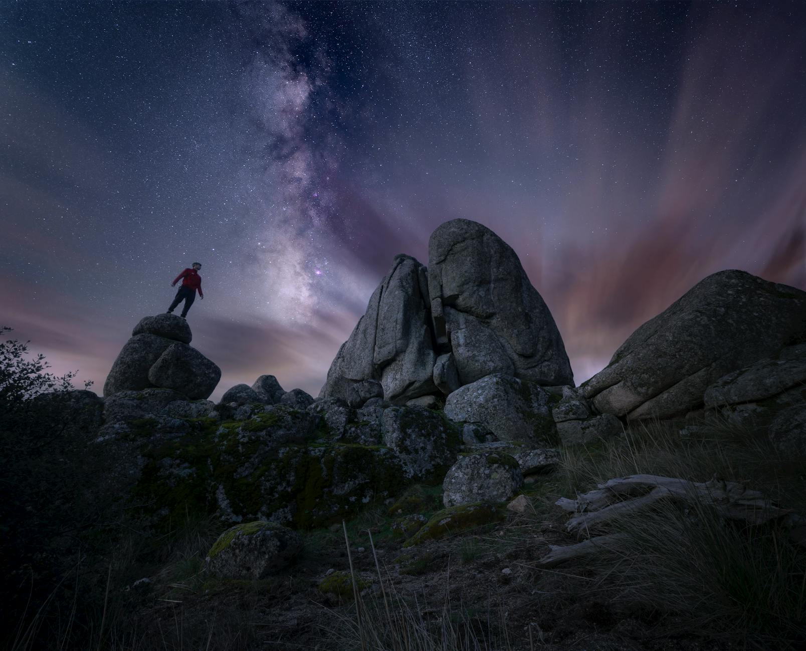 nighttime milky way over rocky landscape